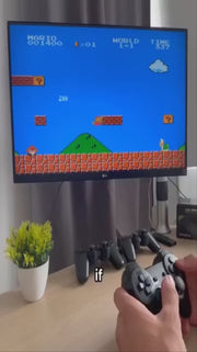 Person playing a classic Super Mario game on a RetroPlay Pro – Wireless HDMI Game Console. The screen displays the iconic 8-bit graphics with a wireless controller in hand.